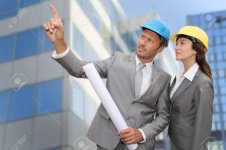 7954223-Construction-engineer-in-front-of-modern-building-Stock-Photo.jpg