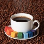 15118474--قهوه-برای-یک-هنرمند-سیگار-فنجان-قهوه-را-با-شکر-رنگی-،-در-دانه-های-قهوه-پس-زمینه.jpg