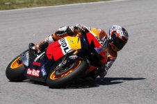 122-1202-01-o-honda-repsol-rider-casey-stoner-in-action-closeup-at-sepang.jpg